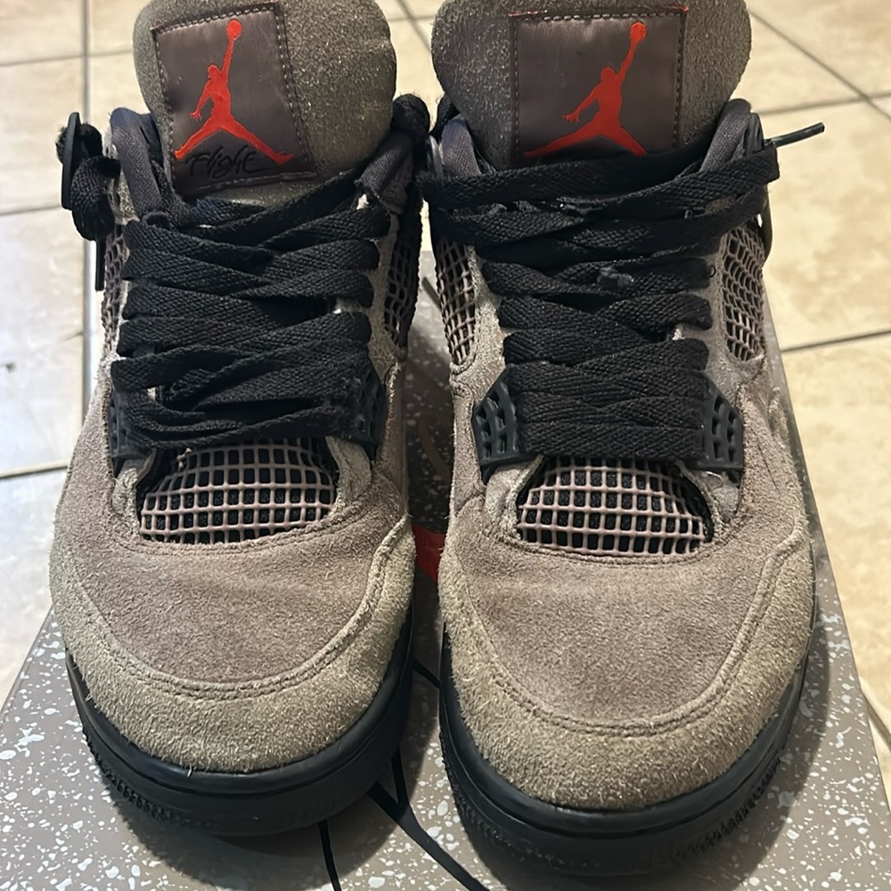 Used Jordan 4 Taupe size 8. Missing inside support wing on right sneaker.